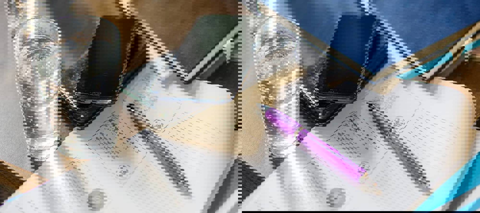 mobile phone and papers on a table